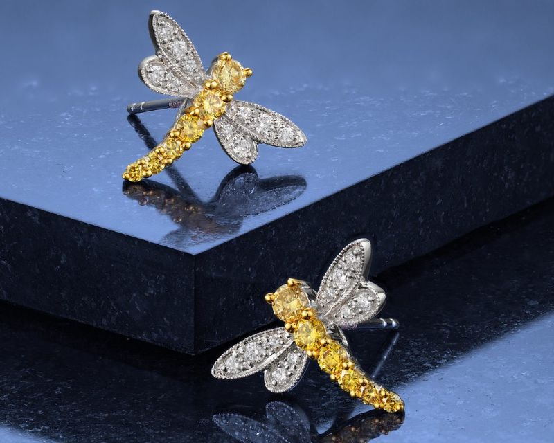 Picture of a pair of yellow and colourless diamond dragonfly earrings, £1,750.