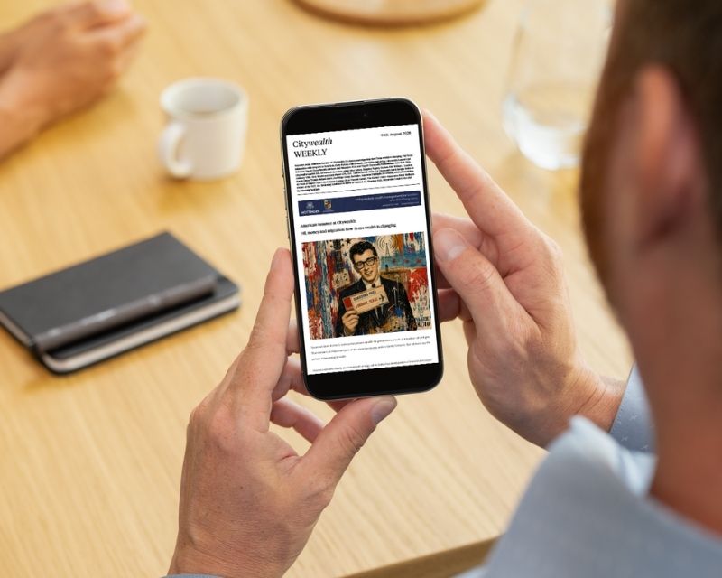 Picture of man reading Citywealth newsletter on a mobile.