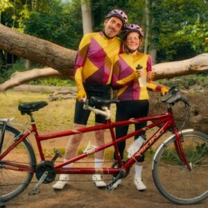 Picture of a couple with bicycle.