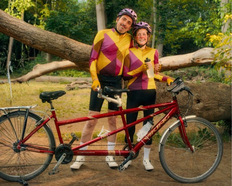 Picture of a couple with bicycle. 